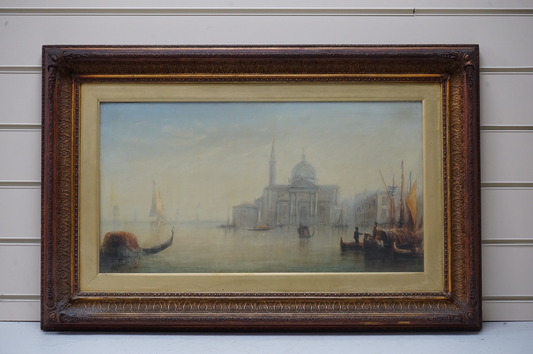 After Guardi (Italian, 1712-1793), oil on canvas, Venetian scene with gondolas, unsigned, 28 x 55cm, ornate frame
